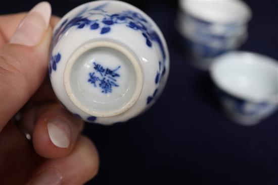 Six 19th century Chinese blue and white horses tea bowls and a later blue and white tray, length 16cm
